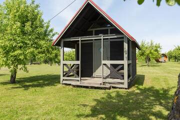 Фото номера Трехместный номер, вид на сад Кемпинги Vetsi Talli Holiday Village г. Kassari 2